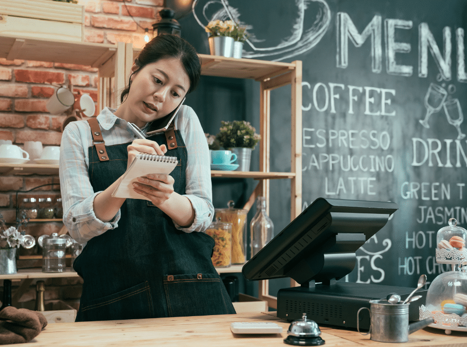 Woman on phone taking restaurant to-go order