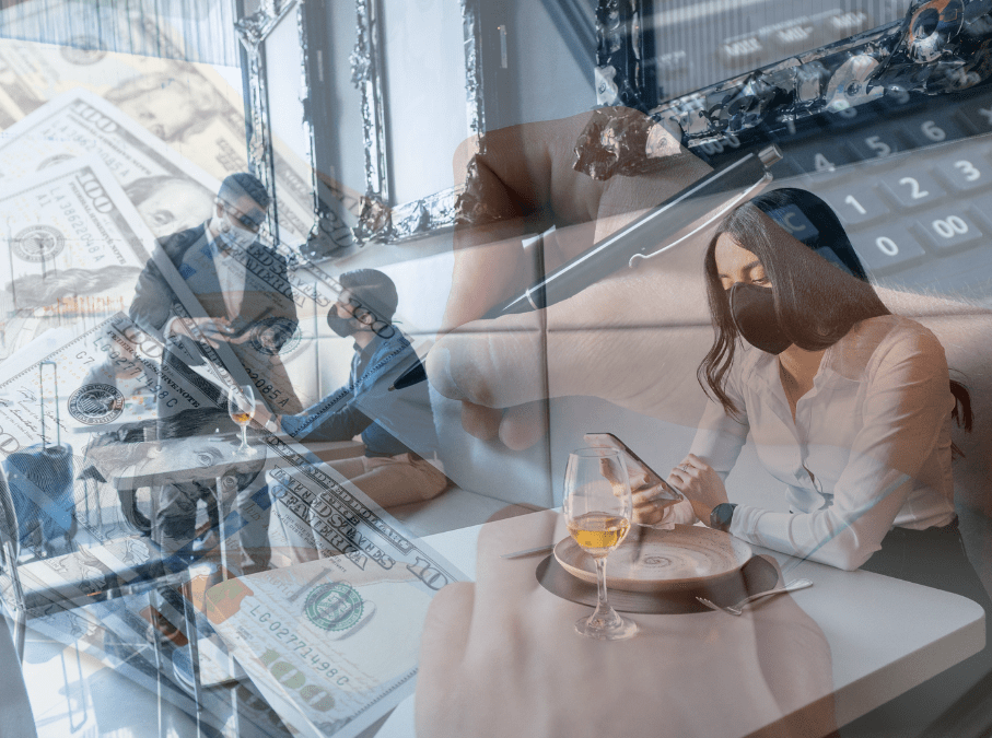 Woman at restaurant on phone with glass of wine