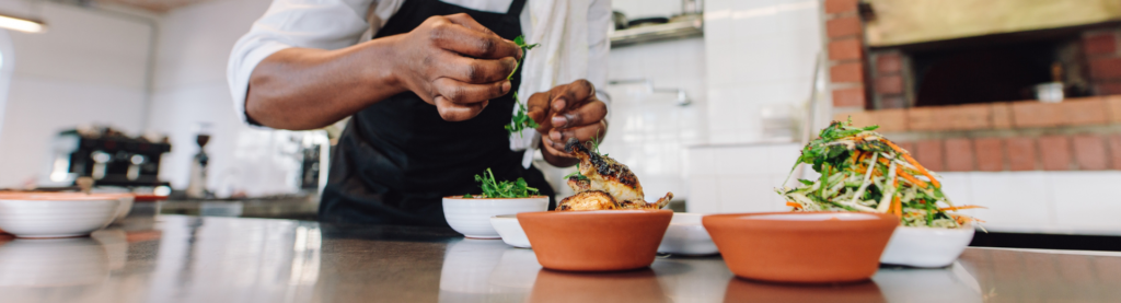 Restaurant Chef plating food in the kitchen