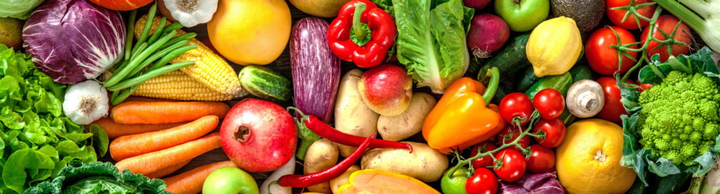 Fresh, colorful variety of vegetables spread on a table.